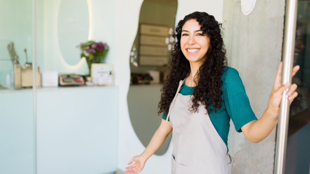 A host greeting shoot guests with a friendly smile at the entrance.