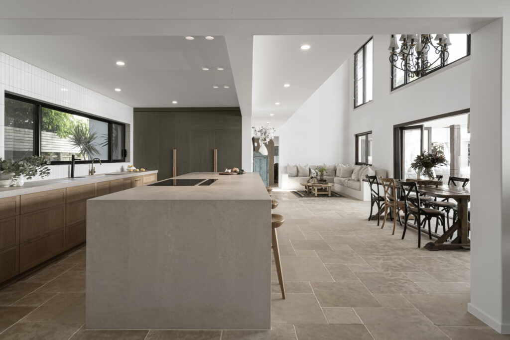 A bright living room with large windows letting in natural light.