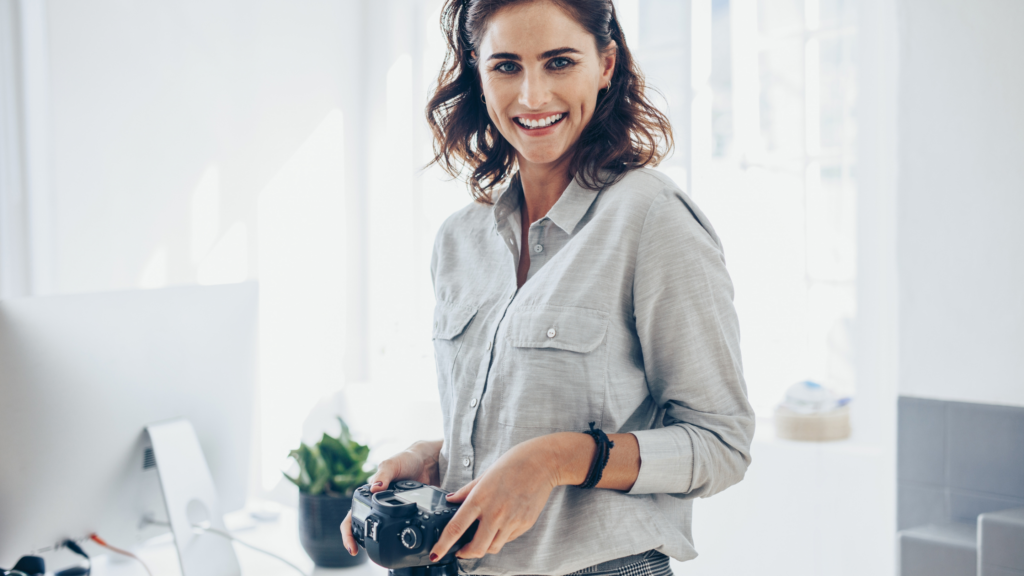 Professional photographer setting up equipment to photograph a beautifully styled photoshoot location.