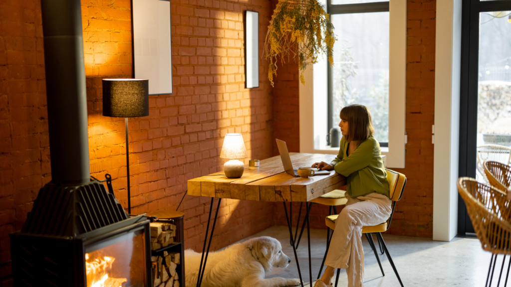 A woman on her laptop posting a picture of a shoot location, generating high engagement and interest.