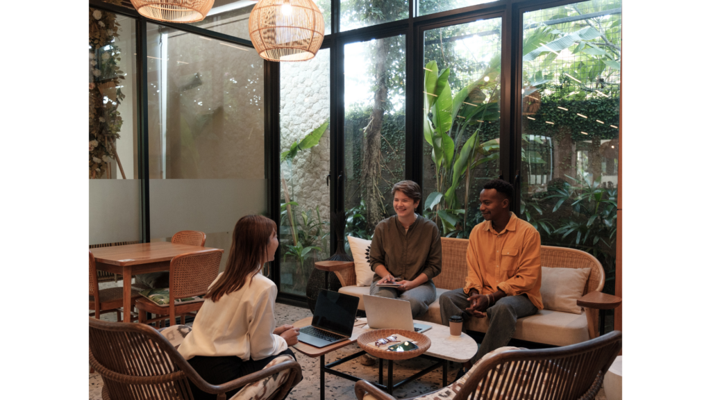 A host networking with industry professionals at a meeting.